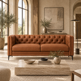 Load image into Gallery viewer, A tufted leather 2 piece sofa in a warm cognac brown color, styled in a rustic, elegant living room with a stone coffee table, potted plants, and arched windows.
