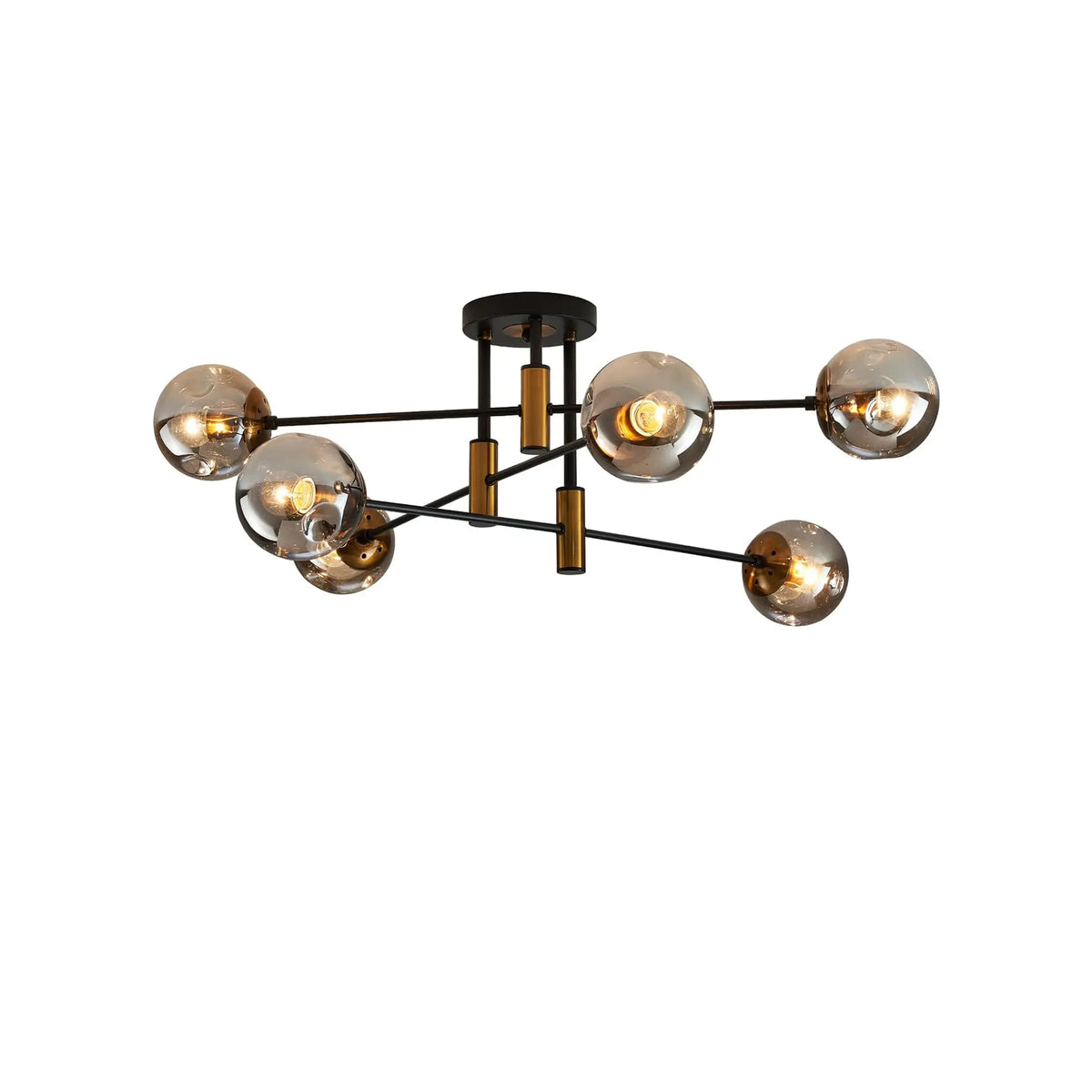 Sputnik chandelier with six smoke gray glass shades and a matte black and gold metal frame on white background