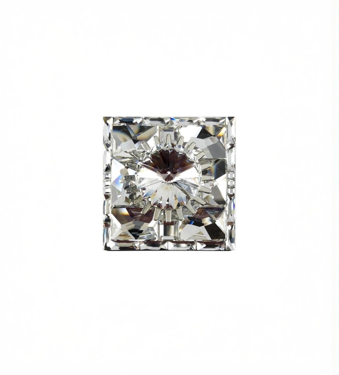 1 1/2 inch square crystal knob with faceted design and reflective clear finish on white background