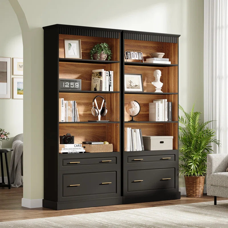 black bookcase set in a room near a faux plant