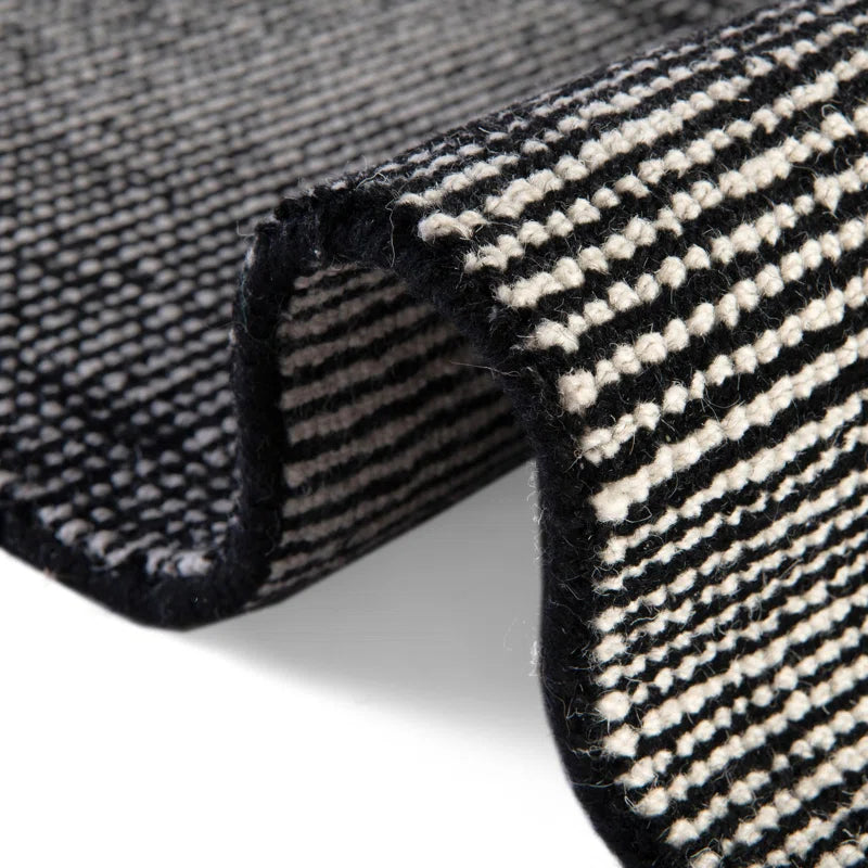 the emery runner rug bent upwards on white floor