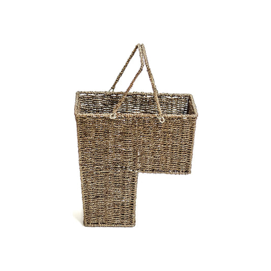 wicker basket for stairs beige with handles designed for holding items on stairs against white background