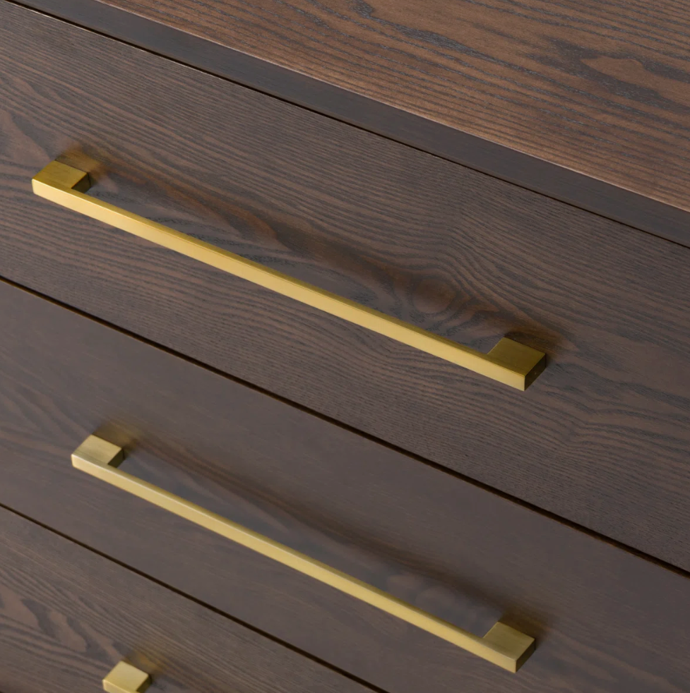 wood dresser close-up of the gold handles