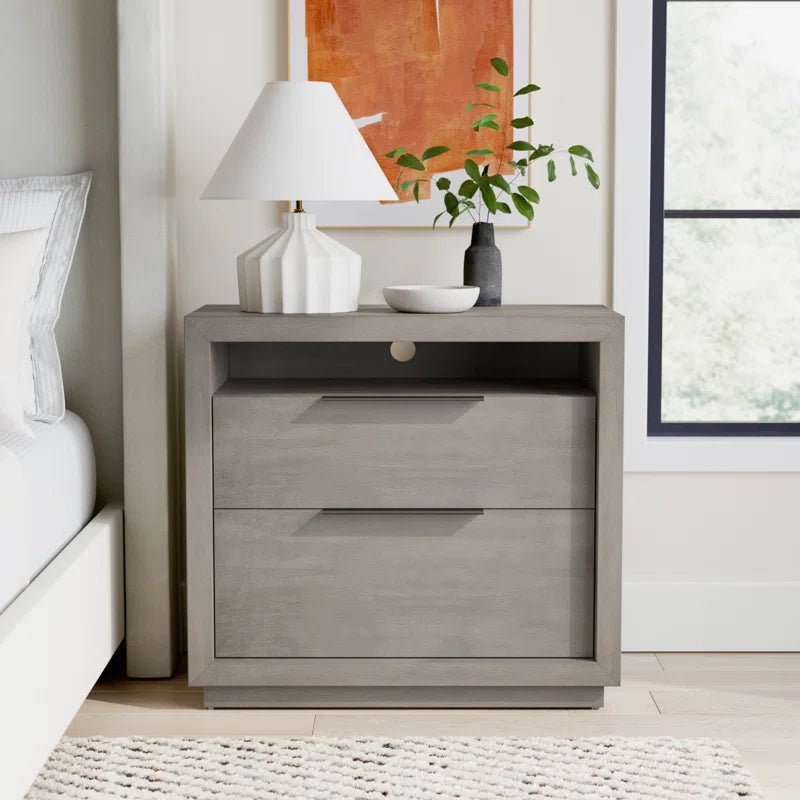 wooden nighstand in bedroom next to bed