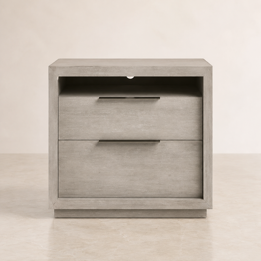 A modern two-drawer nightstand with a light gray wood grain finish and slim horizontal metal handles, set against a neutral beige background.
