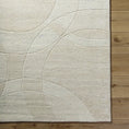 Load image into Gallery viewer, Woven Rug close-up on hardwood floor

