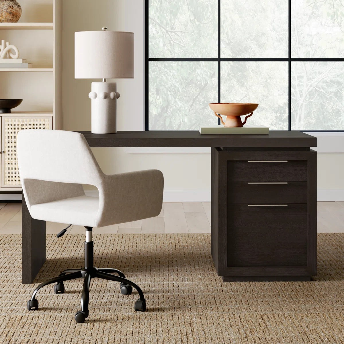 writing desk in an office with a lamp on it and an office chair